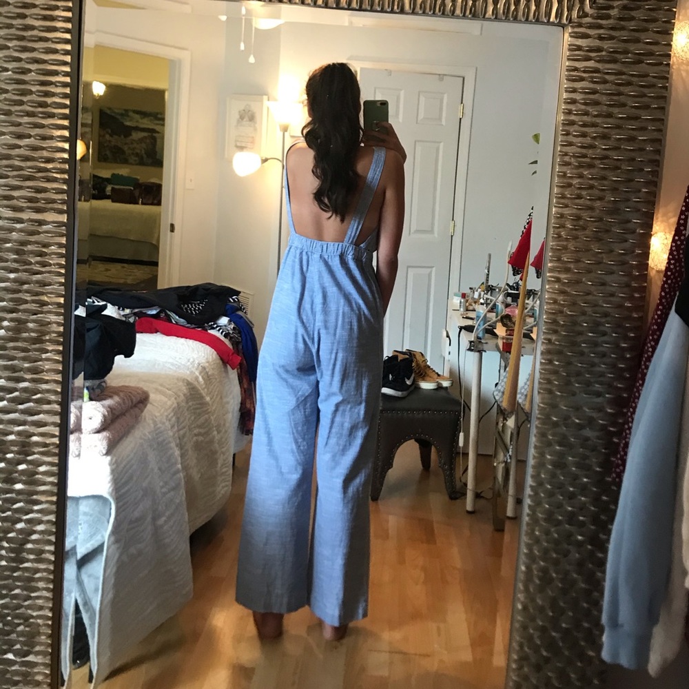 Blue and white jumpsuit with brown buttons